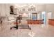 Open concept kitchen featuring a granite island, modern appliances, and ample counter space at 1000 Chillum Ct, Safety Harbor, FL 34695