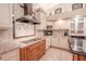 Well-appointed kitchen featuring granite countertops, custom backsplash, and modern appliances at 1000 Chillum Ct, Safety Harbor, FL 34695