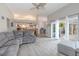 Spacious living room with an open layout, modern flooring, and sliding glass doors leading to the backyard at 1000 Chillum Ct, Safety Harbor, FL 34695