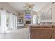 Stylish living room featuring a fireplace, a TV, and sliding doors to the outside for seamless indoor-outdoor living at 1000 Chillum Ct, Safety Harbor, FL 34695