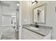 Stylish bathroom with granite countertop and modern fixtures at 11650 County Road 579 Hwy, Thonotosassa, FL 33592
