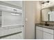 Updated bathroom with granite countertop, modern vanity, and walk-in shower at 11650 County Road 579 Hwy, Thonotosassa, FL 33592