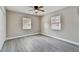 Spacious bedroom with two windows and ceiling fan at 11650 County Road 579 Hwy, Thonotosassa, FL 33592