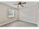 Cozy bedroom with ceiling fan and large window at 11650 County Road 579 Hwy, Thonotosassa, FL 33592