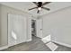 Bedroom with double-door closet and wood-look floors at 11650 County Road 579 Hwy, Thonotosassa, FL 33592