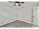 Spacious bedroom with ceiling fan and wood-look flooring at 11650 County Road 579 Hwy, Thonotosassa, FL 33592
