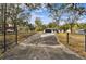 Long private driveway leading to a modern home at 11650 County Road 579 Hwy, Thonotosassa, FL 33592