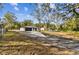 Newly renovated home with a spacious front yard and long driveway at 11650 County Road 579 Hwy, Thonotosassa, FL 33592