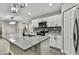 Modern kitchen with granite island, white cabinets, and stylish lighting at 11650 County Road 579 Hwy, Thonotosassa, FL 33592