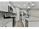 Modern kitchen with stainless steel appliances and granite countertops at 11650 County Road 579 Hwy, Thonotosassa, FL 33592