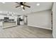 Modern kitchen with island, white cabinets, and granite countertops at 11650 County Road 579 Hwy, Thonotosassa, FL 33592