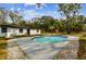 Inviting kidney-shaped pool with surrounding patio at 11650 County Road 579 Hwy, Thonotosassa, FL 33592