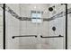 Large walk-in shower with marble-look tile and glass enclosure at 11650 County Road 579 Hwy, Thonotosassa, FL 33592