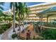Relaxing outdoor space with colorful seating and a deck near the building at 12000 Gulf Blvd # 309N, Treasure Island, FL 33706