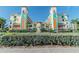 Exterior view of a charming beachfront condo building with a unique architectural design at 12000 Gulf Blvd # 309N, Treasure Island, FL 33706