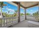 Balcony overlooking lush tropical landscaping and blue skies, perfect for outdoor relaxation at 1388 Brightwaters Ne Blvd, St Petersburg, FL 33704