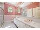 Bathroom featuring a double sink vanity and large mirror at 1388 Brightwaters Ne Blvd, St Petersburg, FL 33704