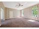 Spacious bedroom with patterned wallpaper and large windows offering ample natural light at 1388 Brightwaters Ne Blvd, St Petersburg, FL 33704