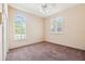 This bedroom features two windows with plantation shutters and a ceiling fan at 1388 Brightwaters Ne Blvd, St Petersburg, FL 33704