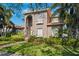 Two-story house with a beautiful front yard and landscaping at 1388 Brightwaters Ne Blvd, St Petersburg, FL 33704