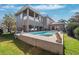 Two-story house with a pool and lush landscaping at 1388 Brightwaters Ne Blvd, St Petersburg, FL 33704
