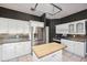 Functional kitchen featuring stainless steel refrigerator and a center island at 1388 Brightwaters Ne Blvd, St Petersburg, FL 33704