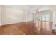 Open living room with parquet flooring, columns, and natural light at 1388 Brightwaters Ne Blvd, St Petersburg, FL 33704