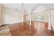 Large living room featuring parquet floors, columns, and view of the front entryway at 1388 Brightwaters Ne Blvd, St Petersburg, FL 33704