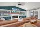 Gathering room with a sectional sofa, fireplace, and access to backyard at 14145 Spoonbill Ln, Clearwater, FL 33762
