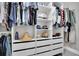 Spacious walk-in closet with ample shelving and hanging space at 14145 Spoonbill Ln, Clearwater, FL 33762