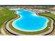 Large Crystal Lagoon with surrounding community at 16820 Anchor Root St, Wimauma, FL 33598