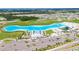 Aerial view of community pool and surrounding homes at 16820 Anchor Root St, Wimauma, FL 33598