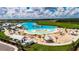 Resort-style pool with sandy beach and cabanas at 16820 Anchor Root St, Wimauma, FL 33598