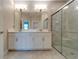 Bathroom with double vanity, and a large glass shower at 16820 Anchor Root St, Wimauma, FL 33598