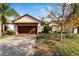 Attractive single-story home with a two-car garage and landscaped yard at 16820 Anchor Root St, Wimauma, FL 33598