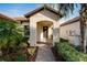 Welcoming front entry with covered porch and walkway at 16820 Anchor Root St, Wimauma, FL 33598