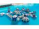 Aerial view of inflatable waterpark at Crystal Lagoon at 16820 Anchor Root St, Wimauma, FL 33598