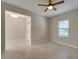 Open living room with tile floors and access to entryway at 16820 Anchor Root St, Wimauma, FL 33598