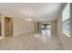 Spacious living room with tile floors and sliding glass doors at 16820 Anchor Root St, Wimauma, FL 33598