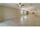 Spacious living room with tile floors and kitchen views at 16820 Anchor Root St, Wimauma, FL 33598