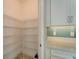 Walk-in pantry with wire shelving offers ample storage at 16820 Anchor Root St, Wimauma, FL 33598