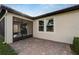 Screened patio with brick pavers and exterior access at 16820 Anchor Root St, Wimauma, FL 33598