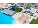 Overhead view of resort amenities including a large pool, cabanas, and sandy beach at 16820 Anchor Root St, Wimauma, FL 33598