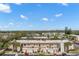 Aerial view of condo community showing building exteriors, parking, and landscaping at 2750 E Bay Dr # 15E, Largo, FL 33771