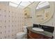 Bathroom with granite countertop and shower at 2750 E Bay Dr # 15E, Largo, FL 33771
