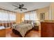 Spacious bedroom with ceiling fan and wood floors at 2750 E Bay Dr # 15E, Largo, FL 33771