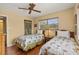 Twins bedroom with ceiling fan and wood floors at 2750 E Bay Dr # 15E, Largo, FL 33771