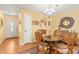 Charming dining area with wood floors and chandelier at 2750 E Bay Dr # 15E, Largo, FL 33771