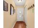 Bright entryway with wood floors and coat rack at 2750 E Bay Dr # 15E, Largo, FL 33771