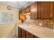 Well-maintained kitchen with wood cabinets and neutral countertops at 2750 E Bay Dr # 15E, Largo, FL 33771